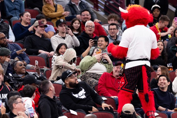 Benny the Bull sprays fans with silly string in the second half of a game against the Portland Trail Blazers at the United Center in Chicago on Feb. 26, 2026. (Josh Boland/Chicago Tribune)