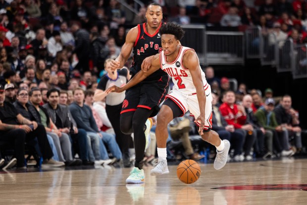 Chicago Bulls guard Collin Sexton (2) makes a move around Toronto Raptors forward Scottie Barnes in the second half of a game against the Toronto Raptors at the United Center in Chicago on Feb. 19, 2026. (Josh Boland/Chicago Tribune)