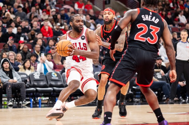 Chicago Bulls forward Patrick Williams (44) makes a move around Toronto Raptors forward Brandon Ingram (3) and guard Jamal Shead (23) in the second half of a game against the Toronto Raptors at the United Center in Chicago on Feb. 19, 2026. (Josh Boland/Chicago Tribune)