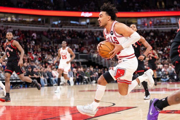 Chicago Bulls guard Tre Jones carries the ball towards the basket in the second half of a game against the Toronto Raptors at the United Center in Chicago on Feb. 19, 2026. (Josh Boland/Chicago Tribune)