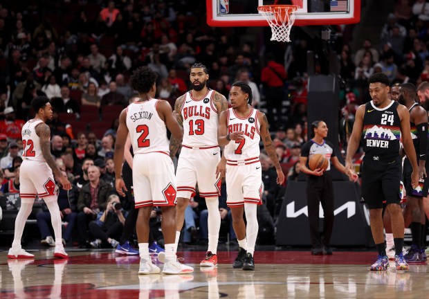 Chicago Bulls guard Anfernee Simons (22), guard Collin Sexton (2), center Nick Richards (13), and guard Rob Dillingham (7) stand on the floor during the first half of a game against the Denver Nuggets at the United Center in Chicago on Feb. 7, 2026. (Chris Sweda/Chicago Tribune)