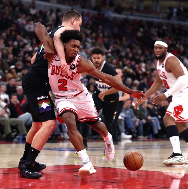 Chicago Bulls guard Collin Sexton (2) has the ball stolen from him by Denver Nuggets center Nikola Jokić (15) in the second half of a game at the United Center in Chicago on Feb. 7, 2026. (Chris Sweda/Chicago Tribune)