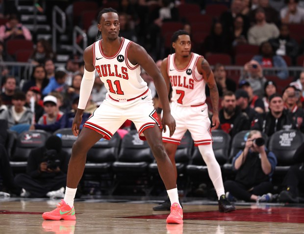Chicago Bulls forward Leonard Miller (11) and guard Rob Dillingham (7) get set on defense in the second half of a game against the Denver Nuggets at the United Center in Chicago on Feb. 7, 2026. (Chris Sweda/Chicago Tribune)