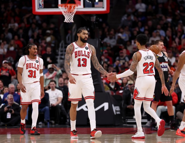 Chicago Bulls guard Jaden Ivey (31), center Nick Richards (13), and guard Anfernee Simons (22), stand on the court together in the first half of a game against the Denver Nuggets at the United Center in Chicago on Feb. 7, 2026. (Chris Sweda/Chicago Tribune)