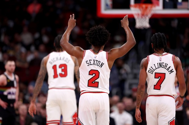Chicago Bulls guard Collin Sexton (2) gives some direction to his teammates Nick Richards (13) and Rob Dillingham (7) in the first half of a game against the Denver Nuggets at the United Center in Chicago on Feb. 7, 2026. (Chris Sweda/Chicago Tribune)