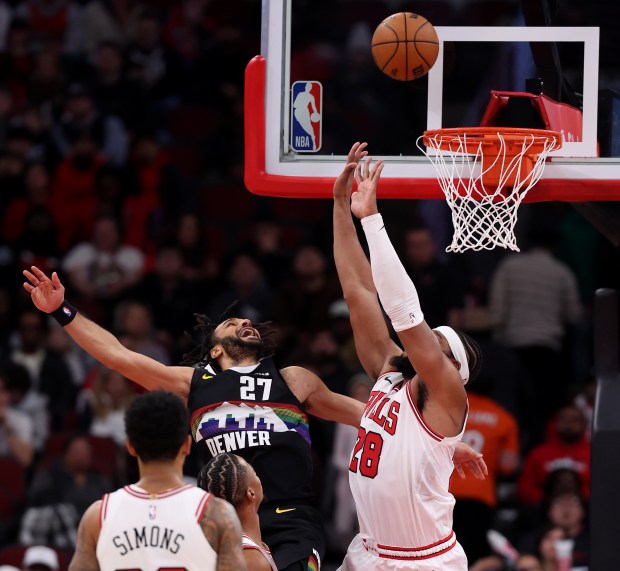 Denver Nuggets guard Jamal Murray (27) shoots over Chicago Bulls center/forward Guerschon Yabusele (28) in the second half of a game at the United Center in Chicago on Feb. 7, 2026. (Chris Sweda/Chicago Tribune)