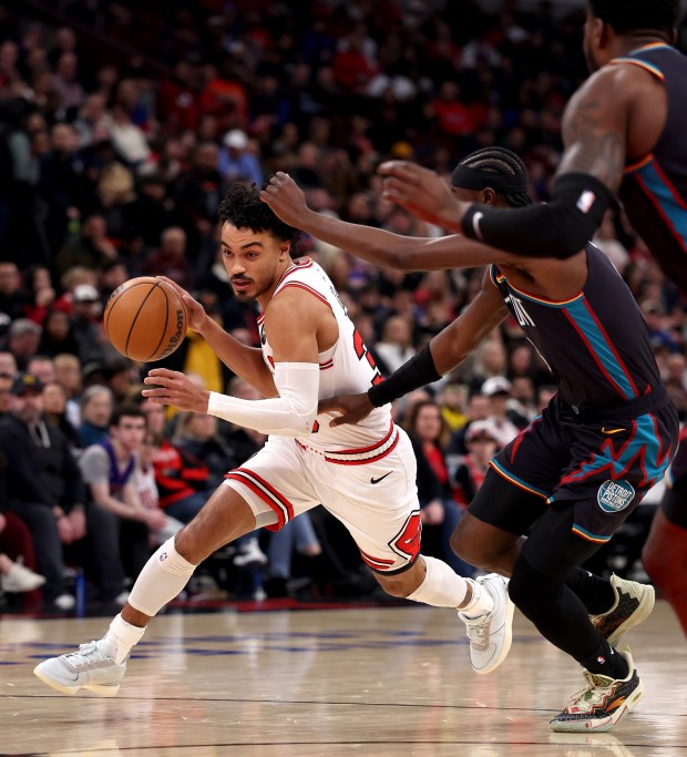 Chicago Bulls guard Tre Jones (30) drives to the hoop in the first half of a game against the Detroit Pistons at the United Center in Chicago on Feb. 21, 2026. (Chris Sweda/Chicago Tribune)