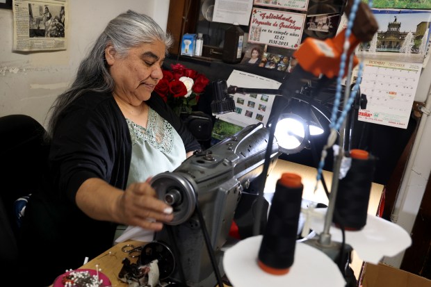 Seamstress Maria Estela Parra works on a Chicago Bulls banner at W.G.N. Flag and Decorating Company in Chicago, Jan. 29, 2026. (Antonio Perez/Chicago Tribune)