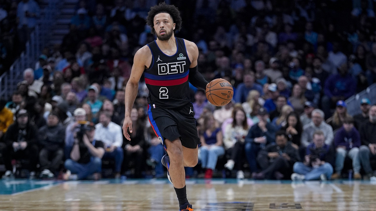 Detroit Pistons guard Cade Cunningham (2) brings the ball up court during the second half against the Charlotte Hornets at Spectrum Center.