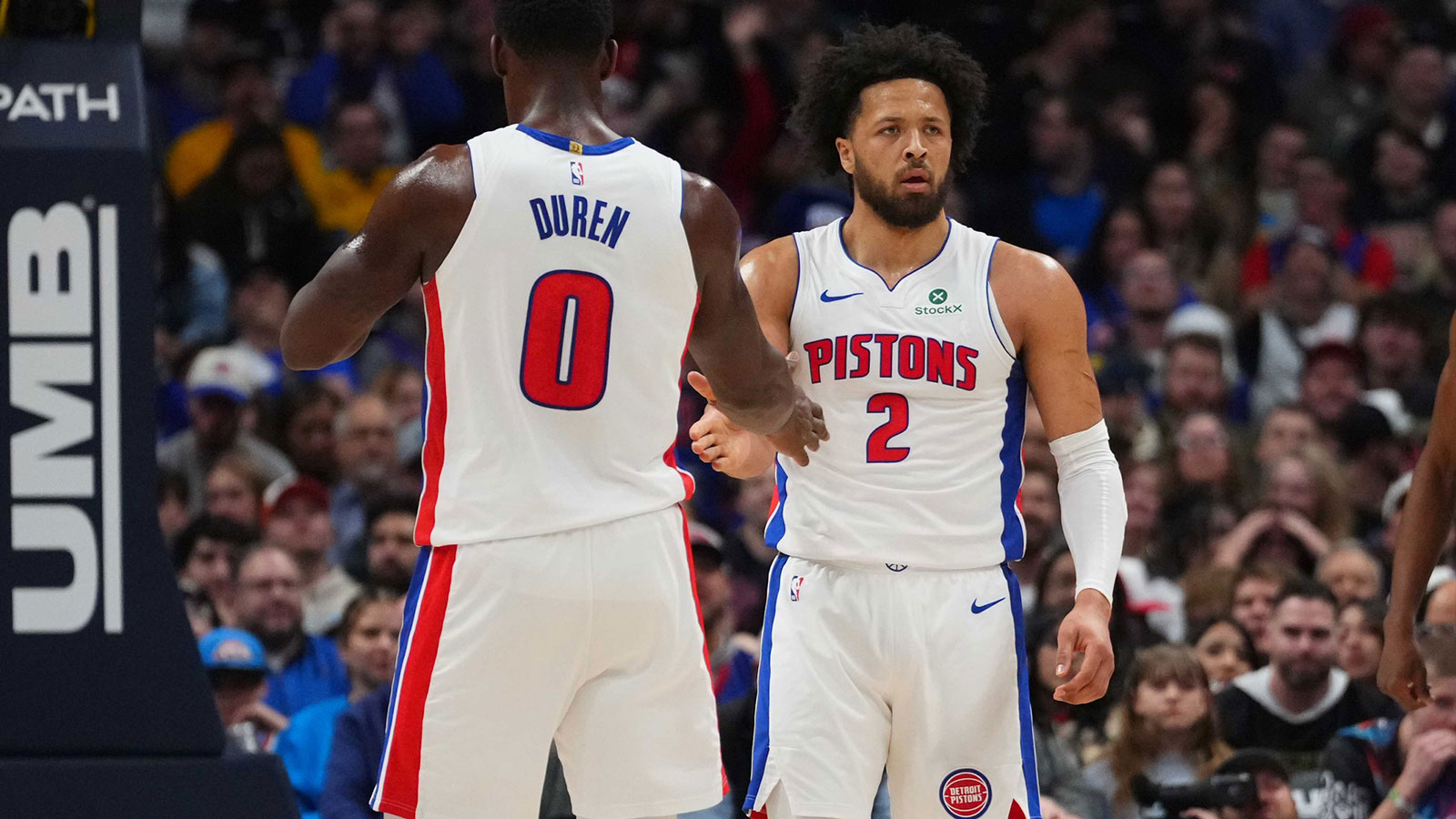 Detroit Pistons guard Cade Cunningham (2) and center Jalen Duren (0) react to a foul called in the first quarter against the Denver Nuggets at Ball Arena. 
