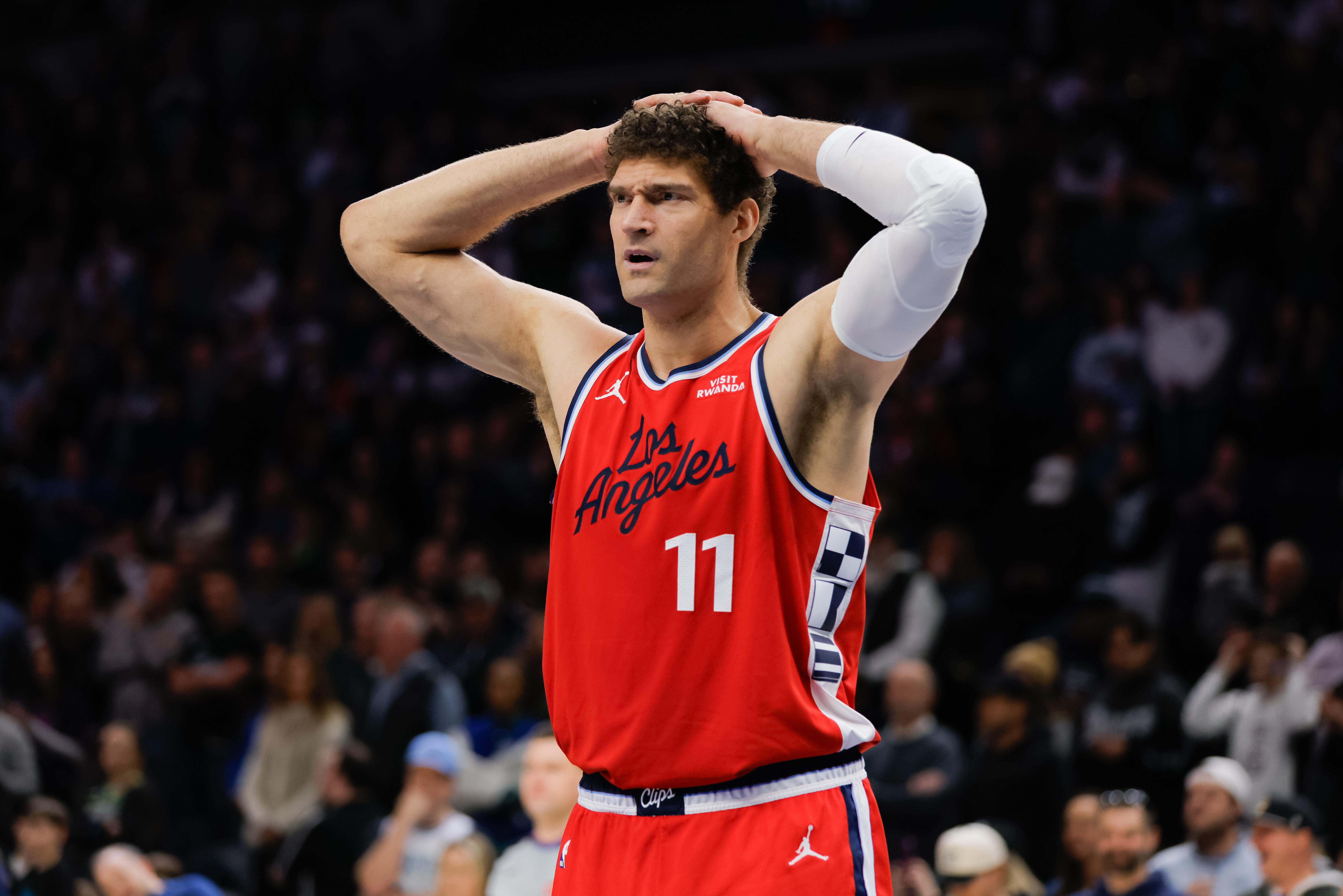 Clippers center Brook Lopez looks on after fouling during the...