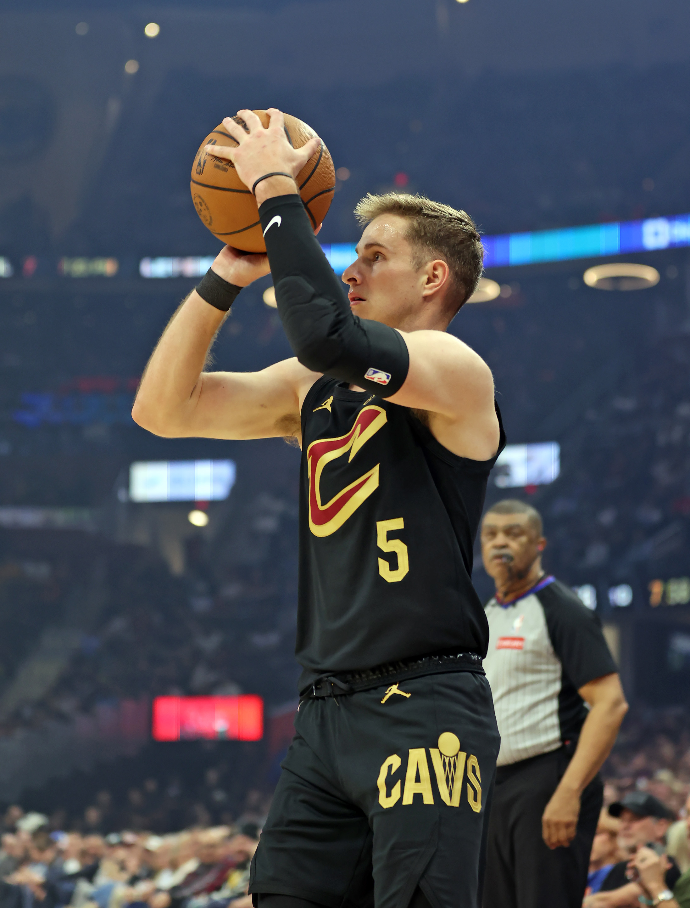 Cleveland Cavaliers guard Sam Merrill shoots a three against the Washington Wizards in the first half of play. 
