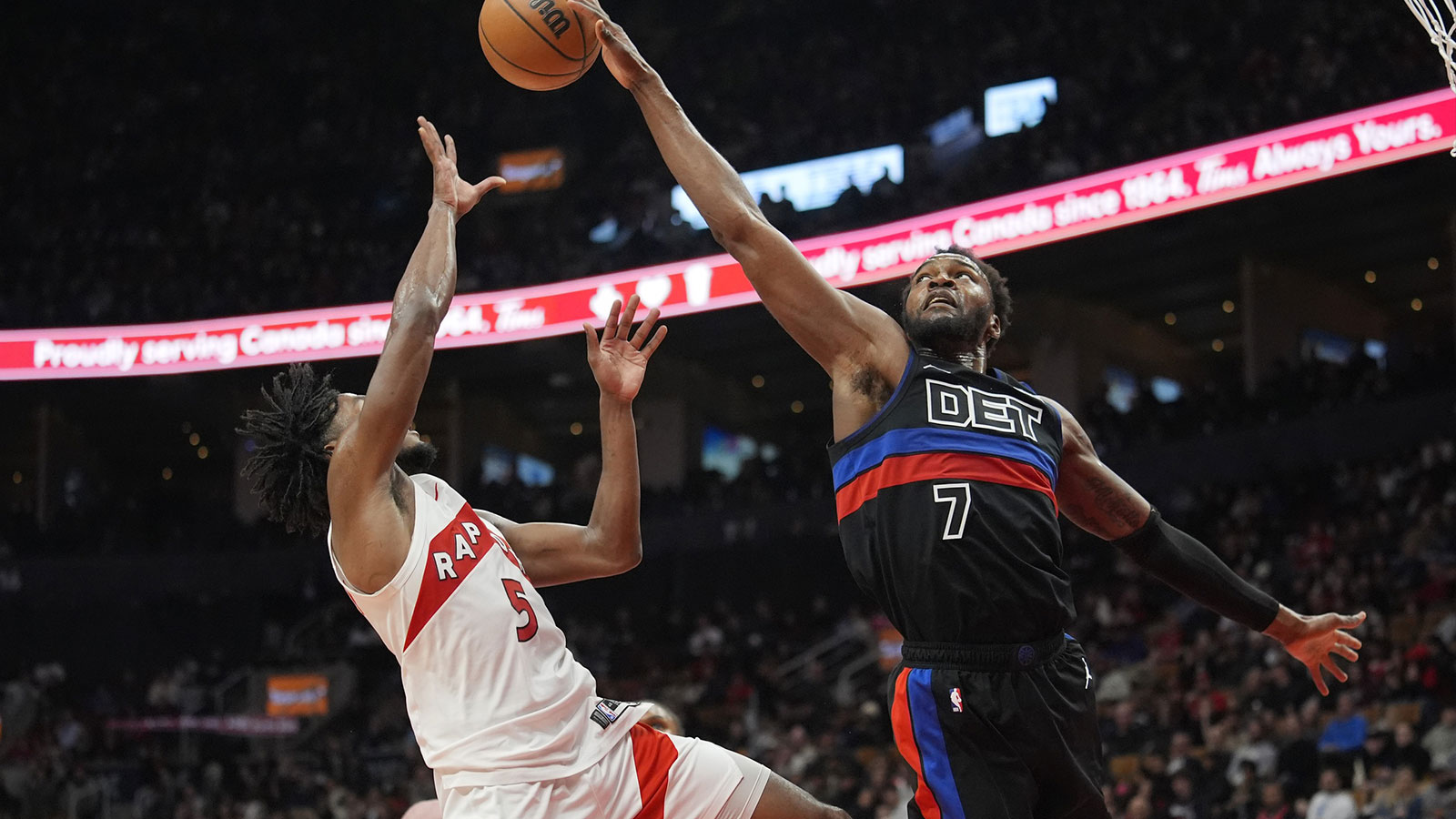 Detroit Pistons center Paul Reed (7) blocks a shot attempt by Toronto Raptors guard Immanuel Quickley (5) during the second half at Scotiabank Arena.