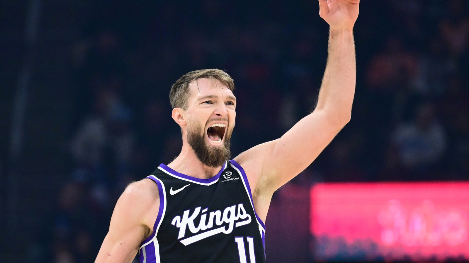Sacramento Kings forward Domantas Sabonis (11) celebrates after hitting a three point basket against the Cleveland Cavaliers during the first half at Rocket Arena.