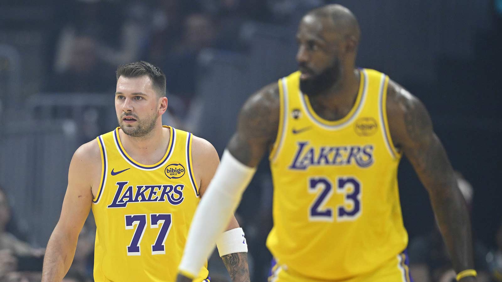 Los Angeles Lakers guard Luka Doncic (77) and forward LeBron James (23) stand on the court in the first quarter against the Cleveland Cavaliers at Rocket Arena.
