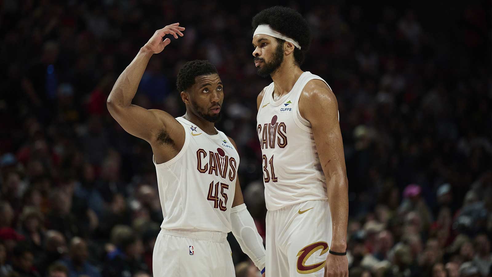 Cleveland Cavaliers guard Donovan Mitchell (45) talks to center Jarrett Allen (31) during the second half against the Portland Trail Blazers at Moda Center. 