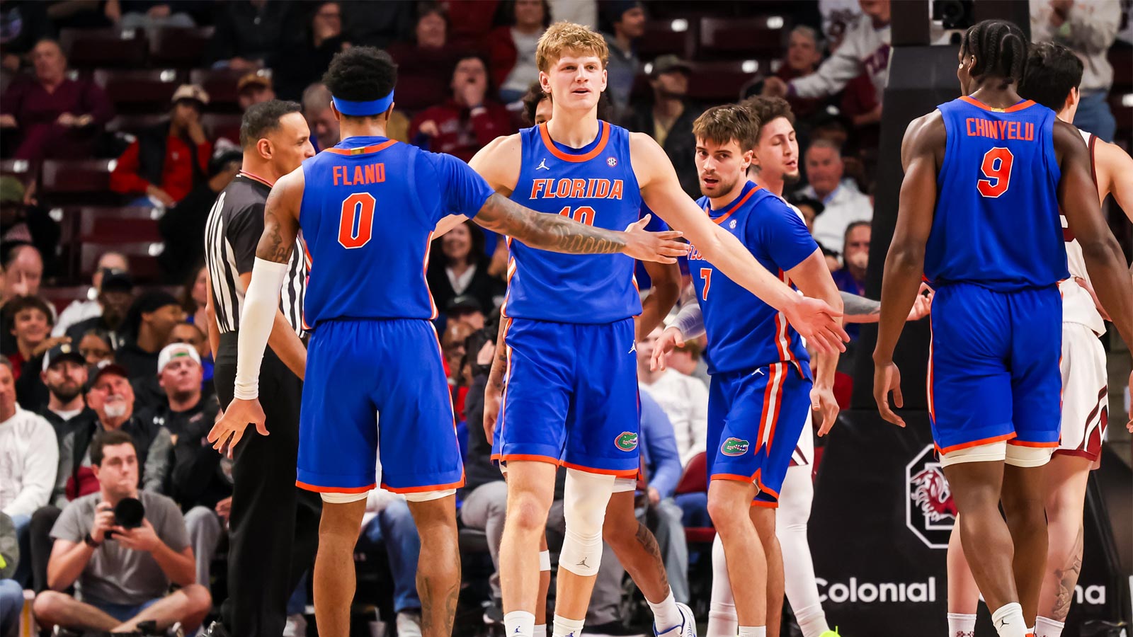 Florida Gators forward Thomas Haugh (10) and guard Boogie Fland (0) celebrate a play against the South Carolina Gamecocks in the first half at Colonial Life Arena.