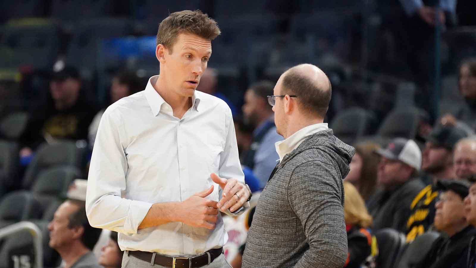 Golden State Warriors general manager Mike Dunleavy chats before the game against the Memphis Grizzlies at Chase Center.