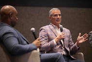 (From left) Moderator Javier David, business editor of the The Dallas Morning News, listens...