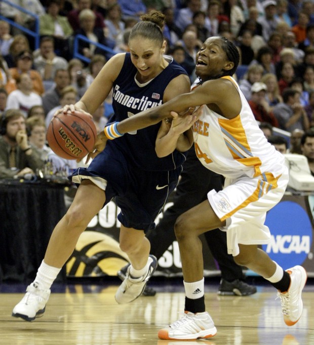 NEW ORLEANS, LA; 4/6/04: Diana Taurasi drives around LaToya in the 2nd half. La Toya fouled out of the game. Taurasi finished with 17 points. UConn plays Tennessee fir the NCAA National Championship at New Orleans Arena. (DIGITAL) Michael McAndrews / The Hartford CourantUConn women's team