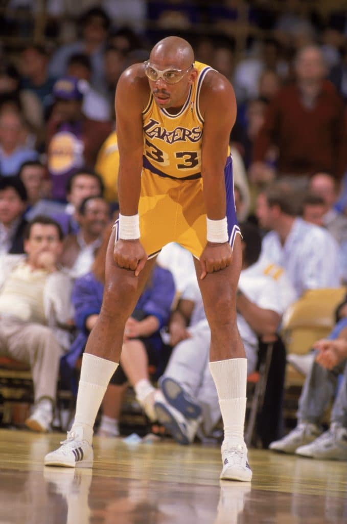 LOS ANGELES - 1987:  Kareem Abdul-Jabbar #33 of the Los Angeles Lakers rests during an NBA game at the Great Western Forum in Los Angeles, California in 1987. 