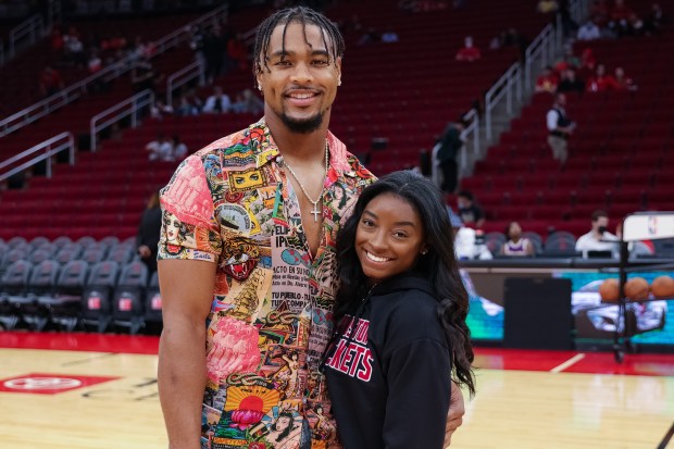 Simone Biles and Jonathan Owens attend a game between the Houston Rockets and the Los Angeles Lakers.