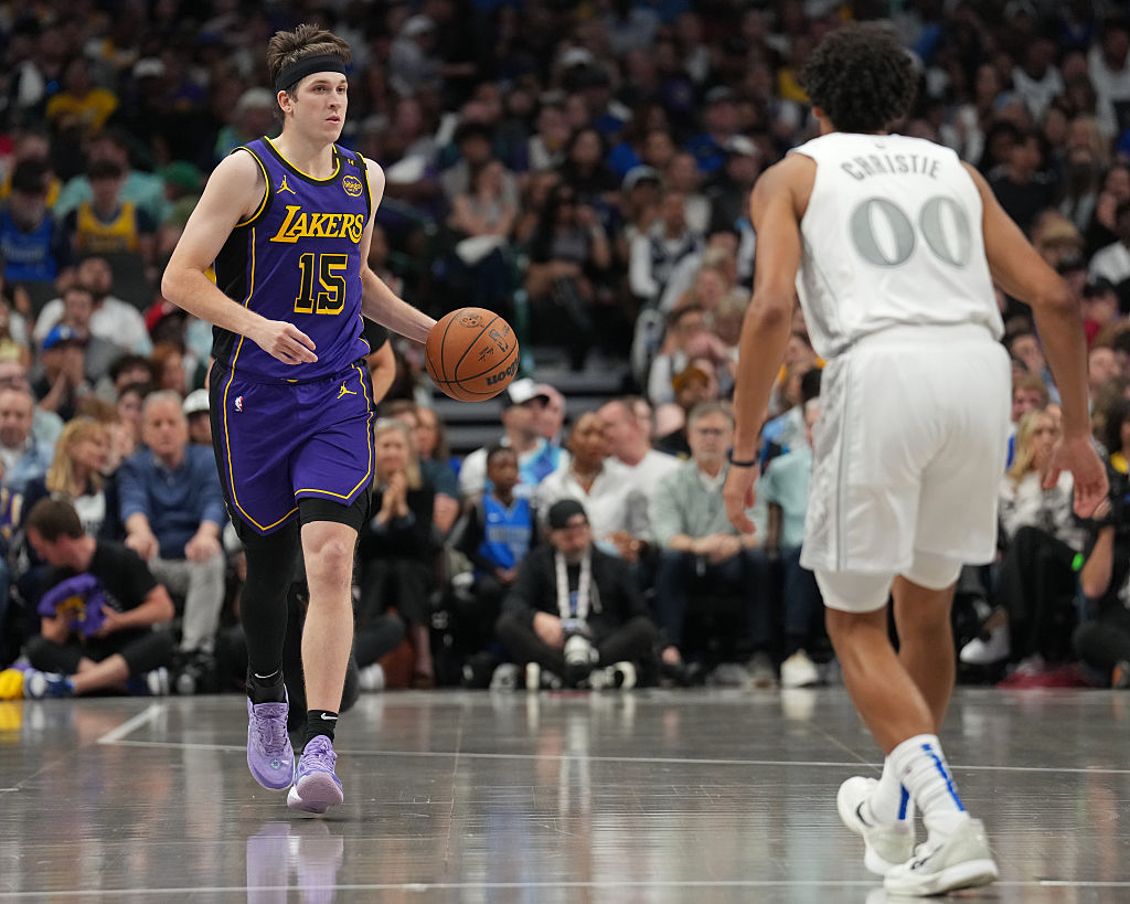 DALLAS, TX - APRIL 9: Austin Reaves #15 of the Los Angeles Lakers brings the ball up court during the game against the Dallas Mavericks on April 9, 2025 at American Airlines Center in Dallas, Texas. NOTE TO USER: User expressly acknowledges and agrees that, by downloading and or using this photograph, User is consenting to the terms and conditions of the Getty Images License Agreement. Mandatory Copyright Notice: Copyright 2025 NBAE(Photo by Glenn James/NBAE via Getty Images)