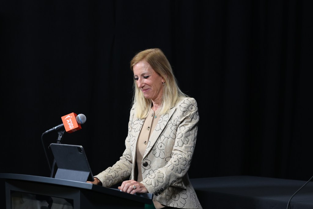 WNBA Commissioner Cathy Engelbert presents 2025 WNBA Coach of the Year award during round 1 game 2 on September 17, 2025 at SAP Center in San Jose, California. 