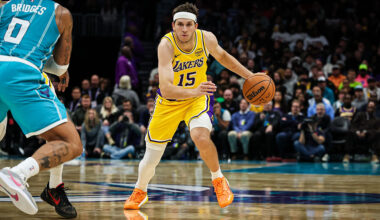 CHARLOTTE, NORTH CAROLINA - NOVEMBER 10: Austin Reaves #15 of the Los Angeles Lakers drives by Miles Bridges #0 of the Charlotte Hornets during the second half of a basketball game at Spectrum Center on November 10, 2025 in Charlotte, North Carolina. NOTE TO USER: User expressly acknowledges and agrees that, by downloading and or using this photograph, User is consenting to the terms and conditions of the Getty Images License Agreement. (Photo by David Jensen/Getty Images)