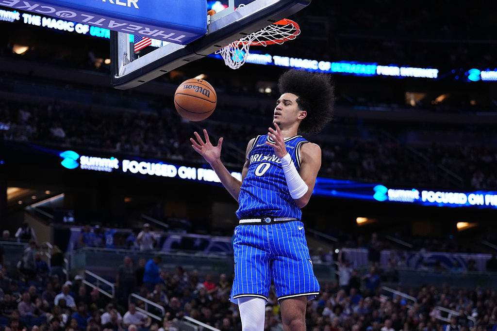 ORLANDO, FLORIDA - DECEMBER 05: Anthony Black #0 of the Orlando Magic dunks the ball against the Miami Heat during the third quarter at Kia Center on December 05, 2025 in Orlando, Florida.