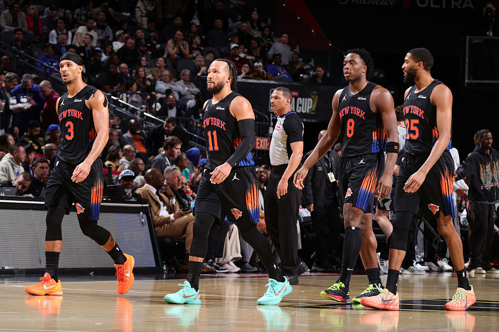 NEW YORK, NY - DECEMBER 16: Josh Hart #3, Jalen Brunson #11, OG Anunoby #8 and Mikal Bridges #25 of the New York Knicks look on during the game against the San Antonio Spurs during the NBA Emirates Cup Final on December 16, 2025 at T-Mobile Arena in Las Vegas, Nevada NOTE TO USER: User expressly acknowledges and agrees that, by downloading and or using this photograph, User is consenting to the terms and conditions of the Getty Images License Agreement. Mandatory Copyright Notice: Copyright 2025 NBAE (Photo by Nathaniel S. Butler/NBAE via Getty Images)