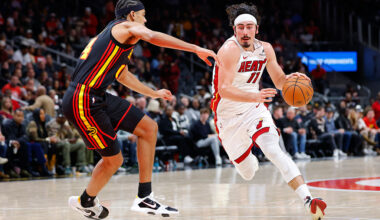 ATLANTA, GEORGIA - DECEMBER 26: Jaime Jaquez Jr. #11 of the Miami Heat drives to the basket against Asa Newell #14 of the Atlanta Hawks during the first quarter at State Farm Arena on December 26, 2025 in Atlanta, Georgia. NOTE TO USER: User expressly acknowledges and agrees that, by downloading and or using this photograph, User is consenting to the terms and conditions of the Getty Images License Agreement. (Photo by Todd Kirkland/Getty Images)