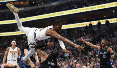 DALLAS, TEXAS - JANUARY 14: Jaden Hardy #1 of the Dallas Mavericks is fouled by Peyton Watson #8 of...