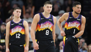 Grayson Allen #8 (C) of the Phoenix Suns with Collin Gillespie #12 and Devin Booker...