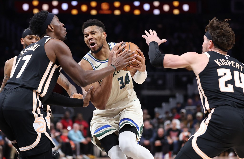 Bucks forward Giannis Antetokounmpo (34) drives against the Hawks' Onyeka Okongwu (17) on Jan. 19, 2026.