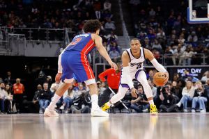 DETROIT, MICHIGAN - JANUARY 25: Russell Westbrook #18 of the Sacramento Kings handles the ball against Cade Cunningham #2 of the Detroit Pistons during the first half at Little Caesars Arena on January 25, 2026 in Detroit, Michigan. NOTE TO USER: User expressly acknowledges and agrees that, by downloading and or using this photograph, User is consenting to the terms and conditions of the Getty Images License Agreement. (Photo by Rey Del Rio/Getty Images)