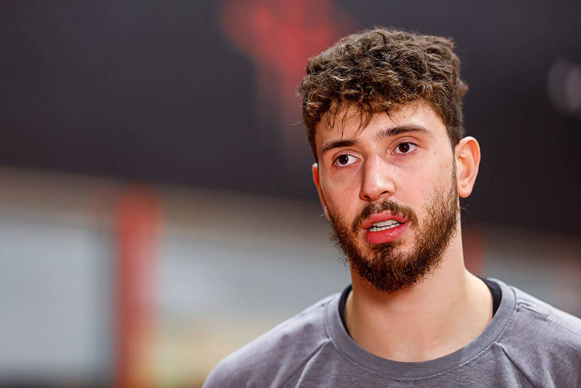 Alperen Şengün looks on during media availability at the Rockets' training facility.