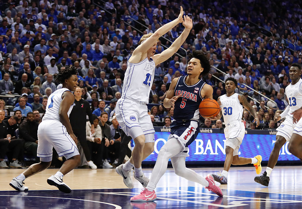 PROVO, UT - JANUARY 26: Brayden Burries #5 of the Arizona Wildcats drives the lane against Richie S...