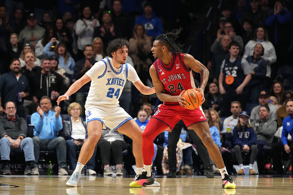 CINCINNATI, OHIO - JANUARY 24: Zuby Ejiofor #24 of the St. John's Red Storm controls the ball against Jovan Milicevic #24 of the Xavier Musketeers during an NCAA basketball game at Cintas Center on January 24, 2026 in Cincinnati, Ohio. (Photo by Jeff Dean/Getty Images)