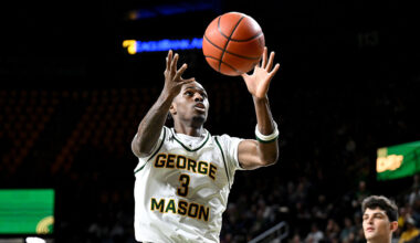 FAIRFAX, VIRGINIA - JANUARY 19: Kory Mincy #3 of the George Mason Patriots grabs a rebound against the George Washington Revolutionaries at EagleBank Arena on January 19, 2026 in Fairfax, Virginia. (Photo by G Fiume/Getty Images)