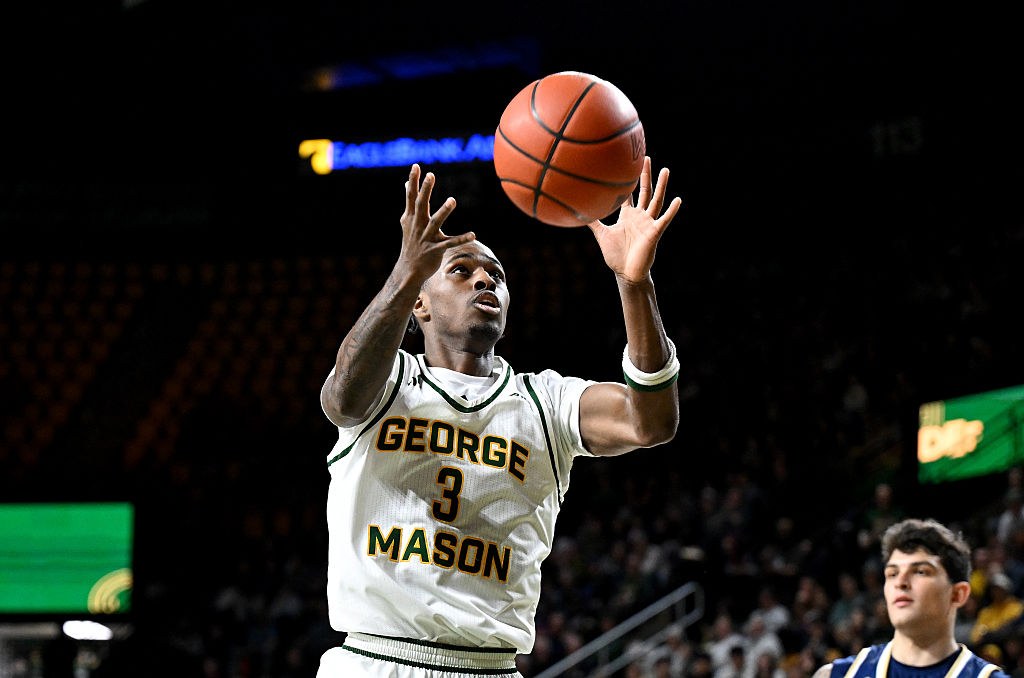 FAIRFAX, VIRGINIA - JANUARY 19: Kory Mincy #3 of the George Mason Patriots grabs a rebound against the George Washington Revolutionaries at EagleBank Arena on January 19, 2026 in Fairfax, Virginia. (Photo by G Fiume/Getty Images)