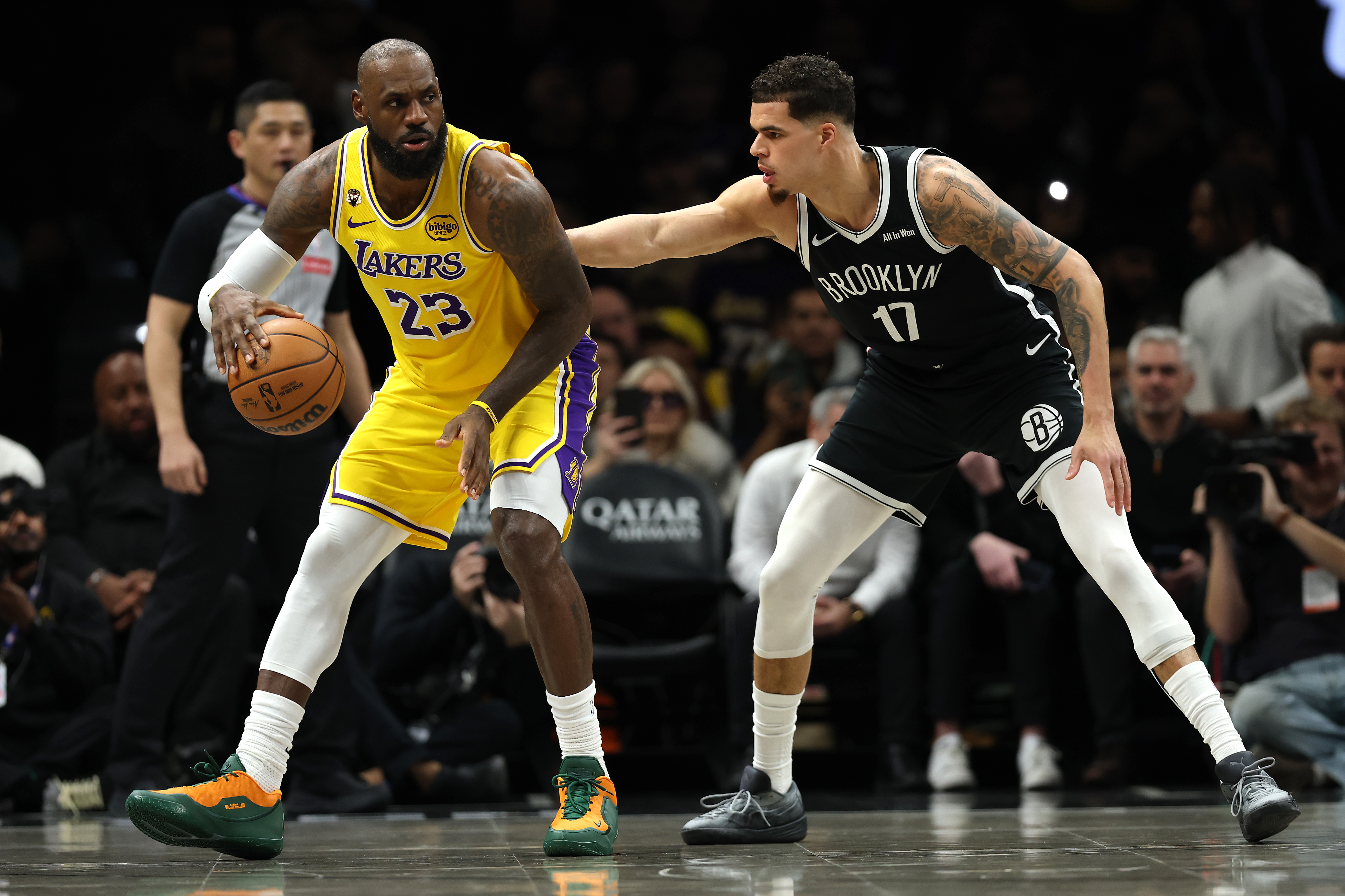 Lakers star LeBron James handles the ball as the Brooklyn...