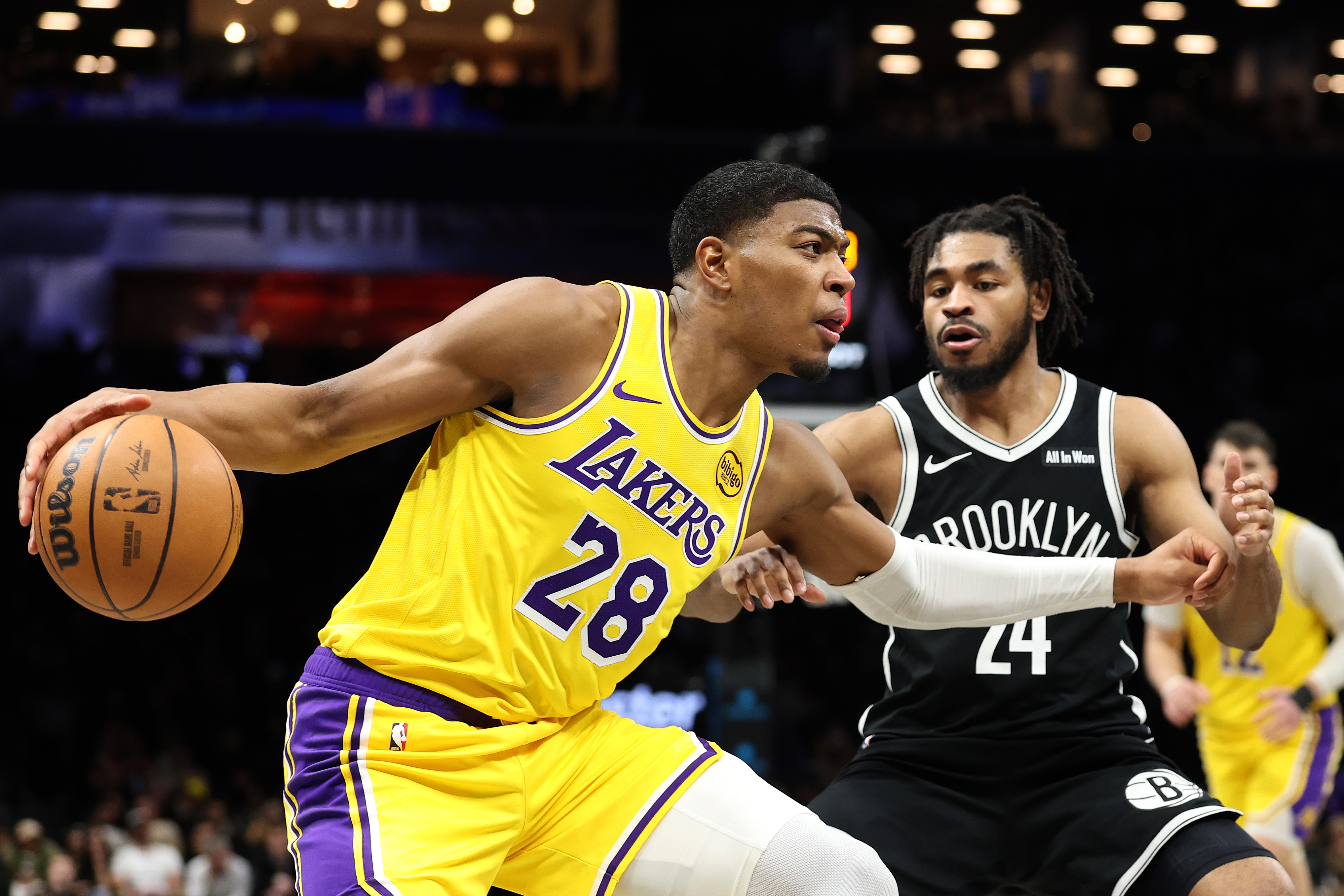 Lakers forward Rui Hachimura drives as the Brooklyn Nets’ Cam...