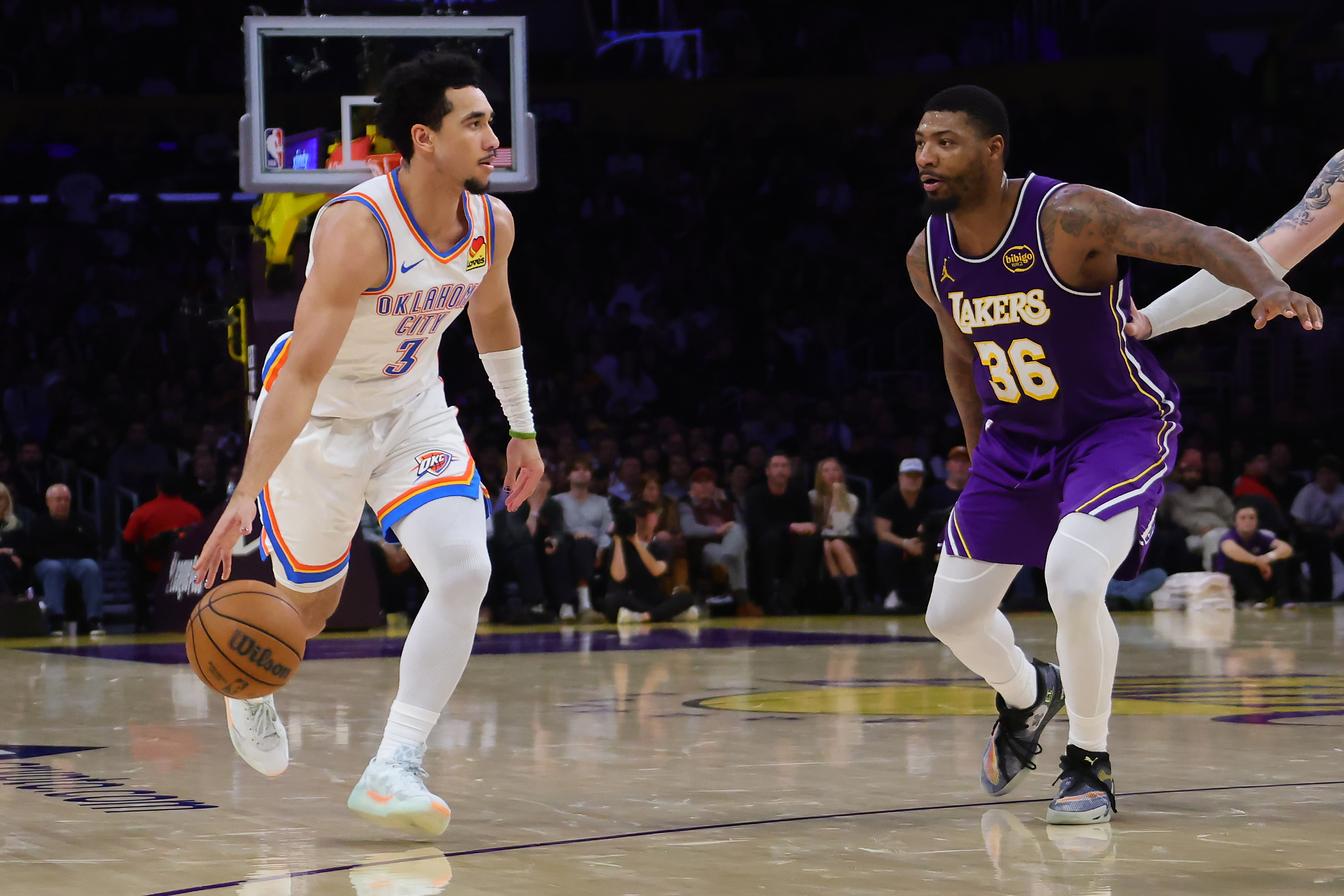 Oklahoma City Thunder guard Jared McCain handles the ball as...