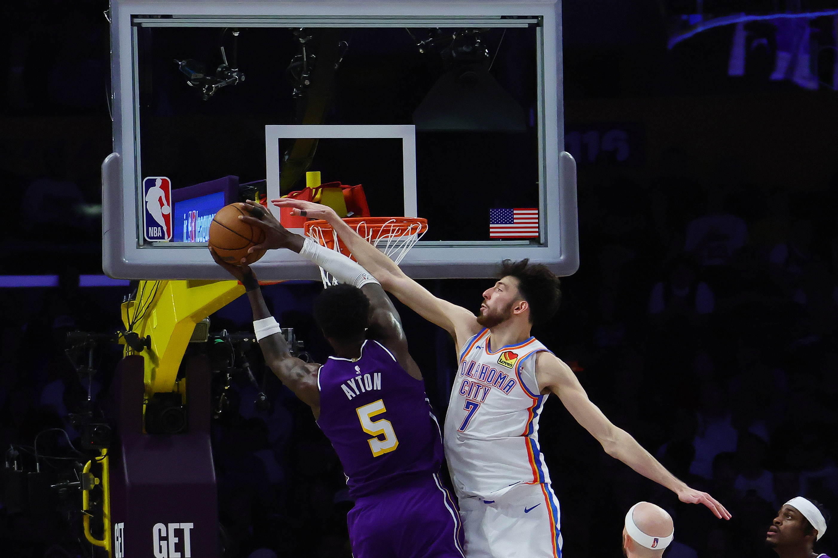 Oklahoma City Thunder forward Chet Holmgren, right, defends as Lakers...