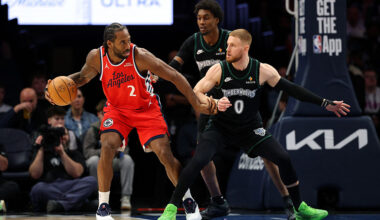 MINNEAPOLIS, MINNESOTA - FEBRUARY 08: Kawhi Leonard #2 of the Los Angeles Clippers goes to the basket against Donte DiVincenzo #0 and Jaden McDaniels #3 of the Minnesota Timberwolves in the third quarter at Target Center on February 08, 2026 in Minneapolis, Minnesota. The Clippers defeated the Timberwolves 115-96.