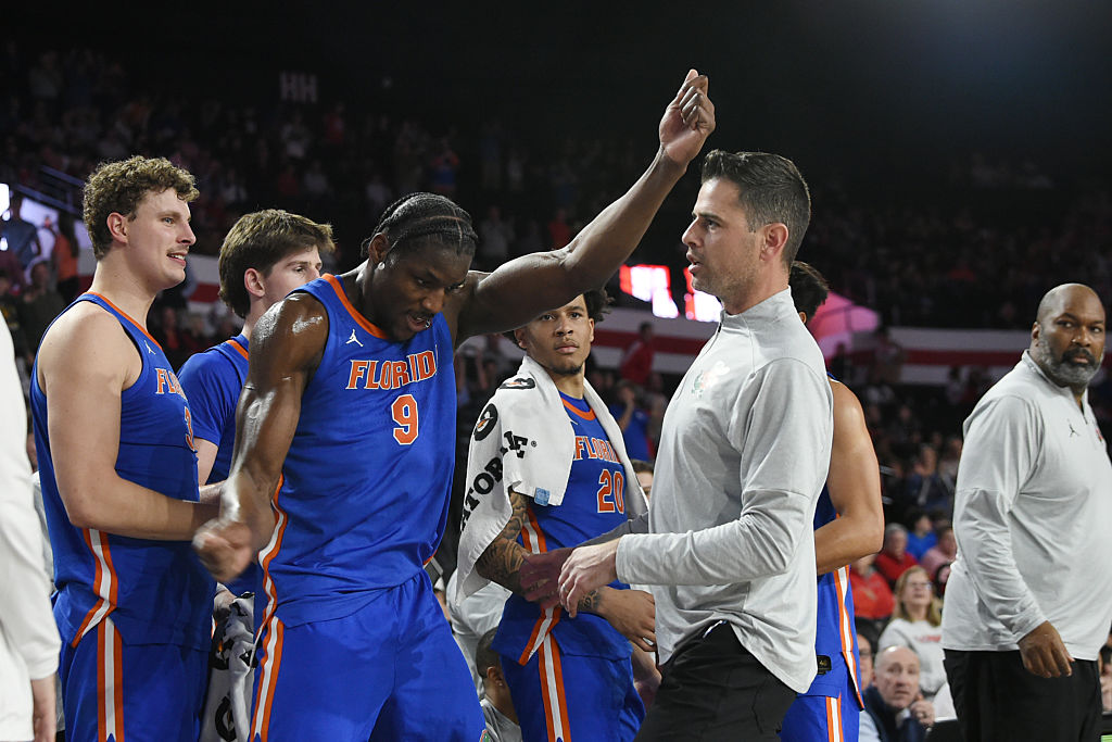 ATHENS, GA - FEBRUARY 11: Center Rueben Chinyelu #9 of the Florida Gators celebrates as head coach Todd Golden of the Florida Gators looks on during the college basketball game between the Florida Gators and the Georgia Bulldogs on February 11, 2026, at Stegeman Coliseum in Athens, GA. (Photo by Jeffrey Vest/Icon Sportswire via Getty Images)