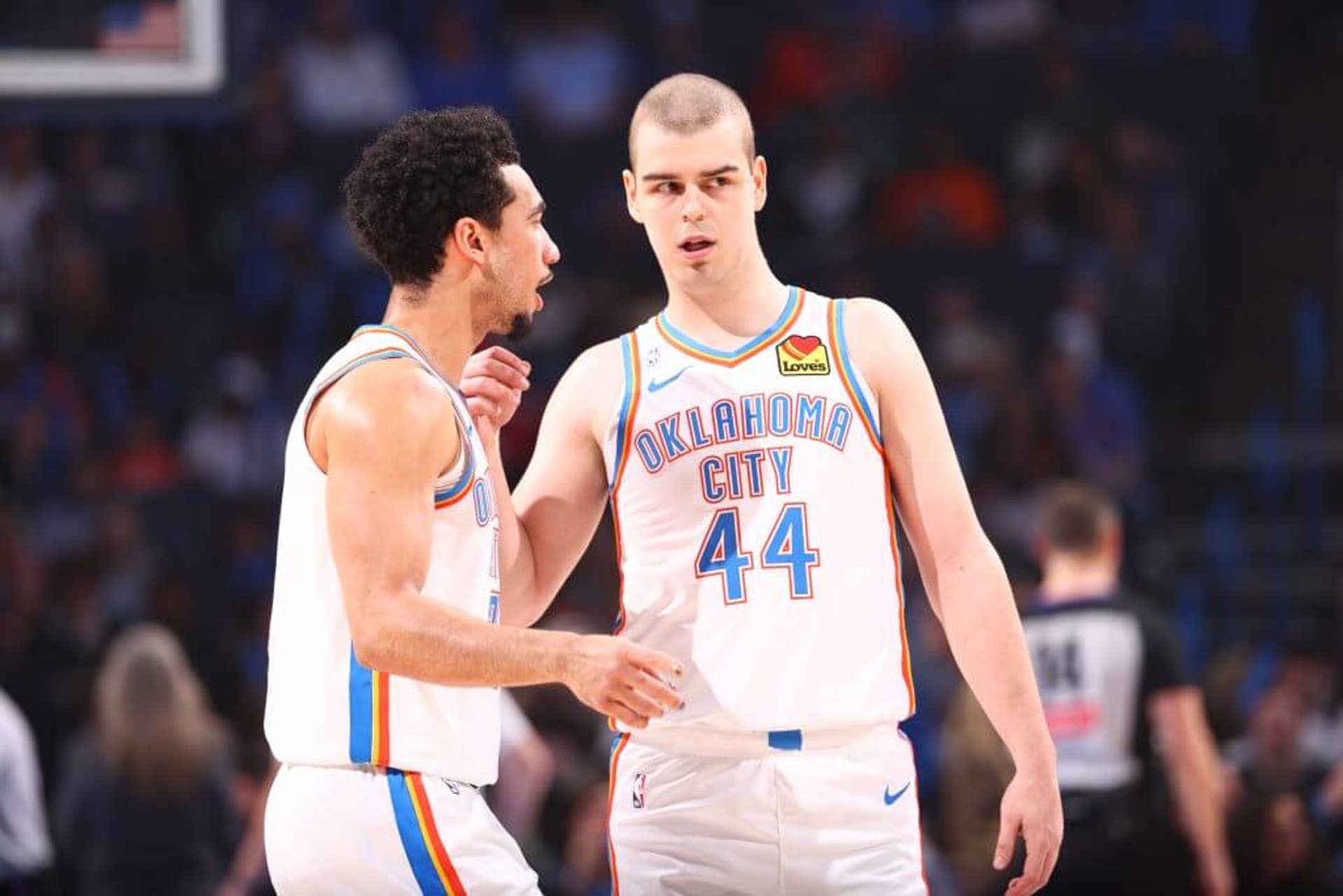 Jared McCain #3 and Nikola Topić #44 of the Oklahoma City Thunder talk during a game against the Milwaukee Bucks on Thursday in Oklahoma City.