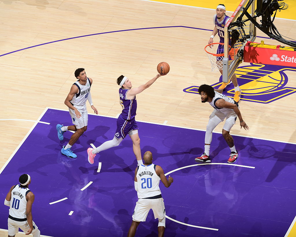 LOS ANGELES, CA - FEBRUARY 12: Austin Reaves #15 of the Los Angeles Lakers drives to the basket during the game against the Dallas Mavericks on February 12, 2026 at Crypto.Com Arena in Los Angeles, California. NOTE TO USER: User expressly acknowledges and agrees that, by downloading and/or using this Photograph, user is consenting to the terms and conditions of the Getty Images License Agreement. Mandatory Copyright Notice: Copyright 2026 NBAE (Photo by Adam Pantozzi/NBAE via Getty Images)