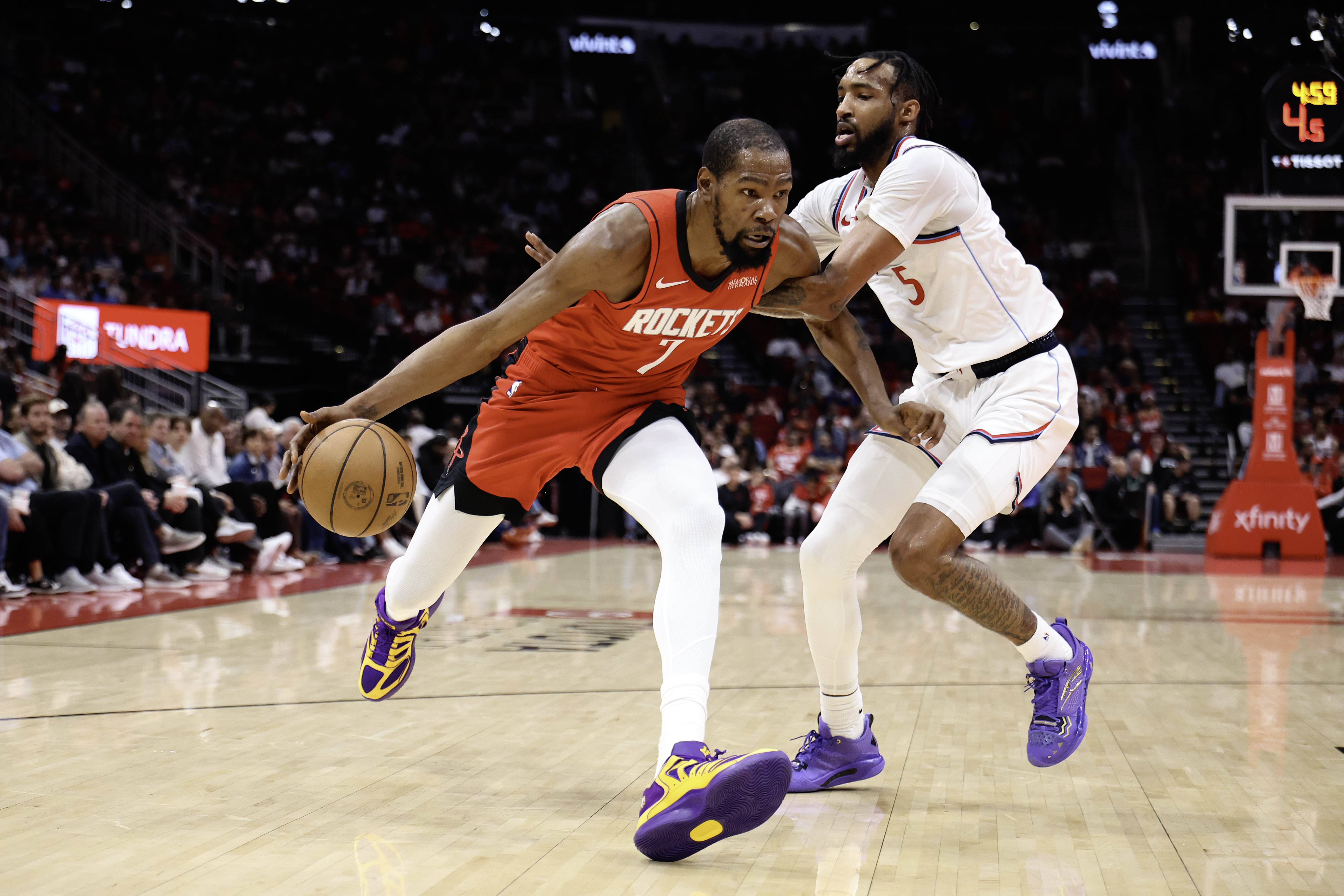 Houston Rockets star Kevin Durant drives to the basket past...